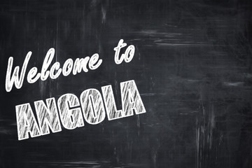 Chalkboard background with chalk letters: Welcome to angola