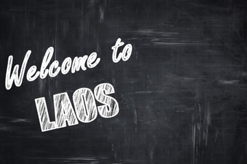 Chalkboard background with chalk letters: Welcome to laos