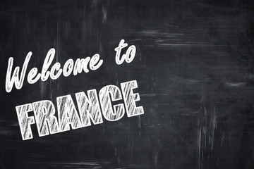 Chalkboard background with chalk letters: Welcome to france