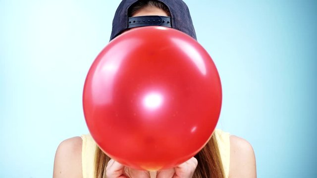 Woman casual style playing with red balloon 4K