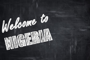 Chalkboard background with chalk letters: Welcome to nigeria