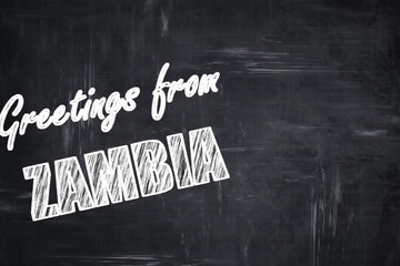 Chalkboard background with chalk letters: Greetings from zambia