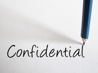 Confidential Text written with pencil on white paper