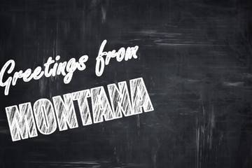 Chalkboard background with chalk letters: Greetings from montana