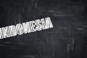 Chalkboard background with chalk letters: Greetings from indones