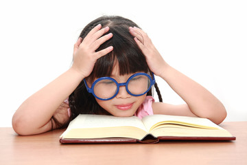 Asian little girl reading a book isolated on a over white backgr