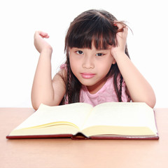 serious little girl  reading a book