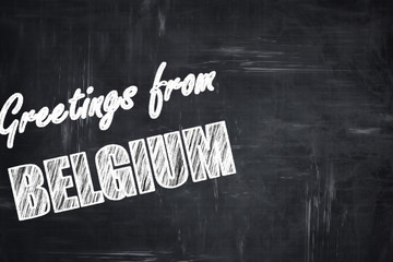 Chalkboard background with chalk letters: Greetings from belgium
