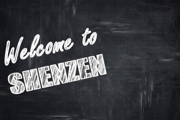 Chalkboard background with chalk letters: Welcome to shenzen