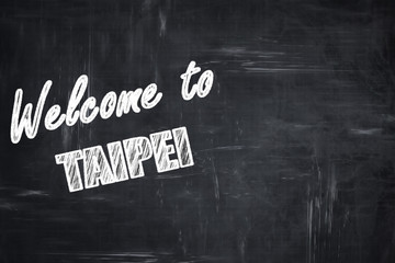 Chalkboard background with chalk letters: Welcome to taipei