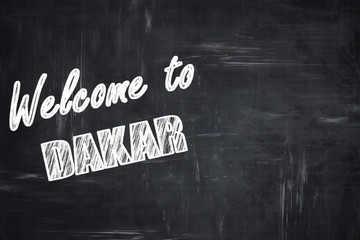 Chalkboard background with chalk letters: Welcome to dakar