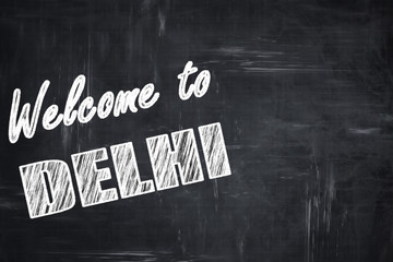 Chalkboard background with chalk letters: Welcome to delhi