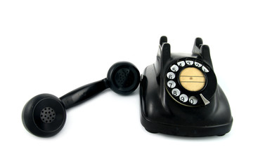 old telephone with rotary dial isolated on white background
