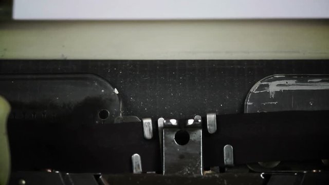 Beginning a new Confidential Document - shallow depth of field and under an angle on a typewriter