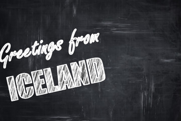Chalkboard background with chalk letters: Greetings from iceland