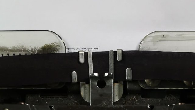 Top Secret Document titled on a conventional typewriter, angle shot, close up, shallow dof