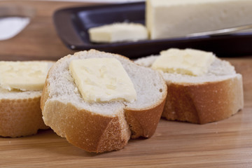 slice baguette with butter