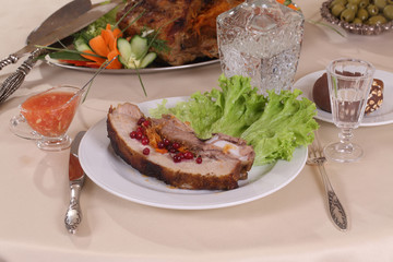 pork stuffed with vegetables and a decanter of vodka