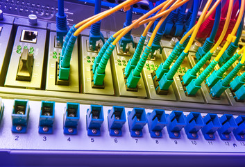 Fiber Optic cables connected to an optic ports and Network cable