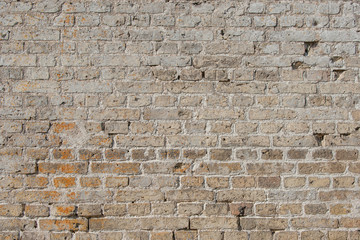 Grungy brick wall with old bricks