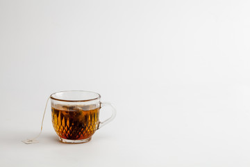 hot tea clear glass white background
