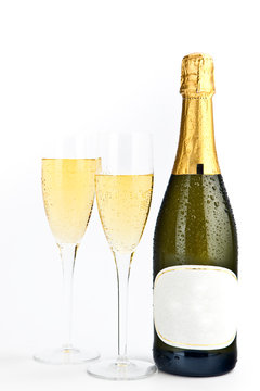 champagne gold bottle with glasses isolated on white