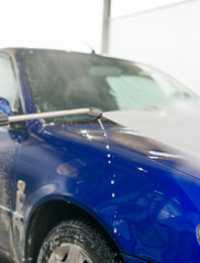 Obraz na płótnie Canvas Car wash using high pressure water jet.