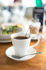 Cup of tea on the table in cafe.