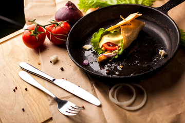 food composition on cast-iron pan horizontally