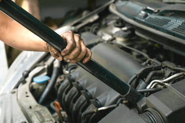 Fototapeta na wymiar Cleaning car / Cleaning car engine by using vacuum cleaner.