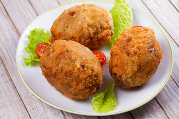 Scotch Eggs Served with Tomato Cherry and Salad on White Plate
