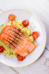 Salmon, Tomato and Smashed Potato with  Spring Onion and Coriander. View From Above, Top Studio Shot
