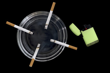 four lighted cigarettes in an ashtray