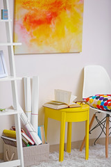 Vivid home interior with yellow coffee table and decorations