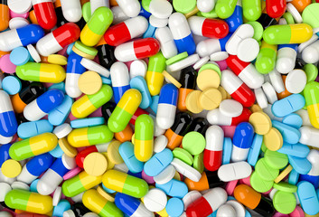 Fototapeta na wymiar Medical background with colorful pills and capsules