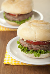 chicken burger with slice tomato and lettuce