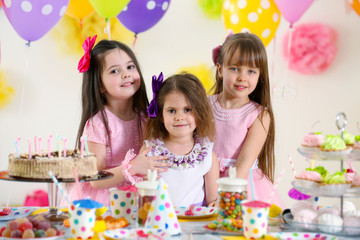 Happy little girls at birthday party