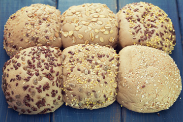 bread with seeds on blue wooden background