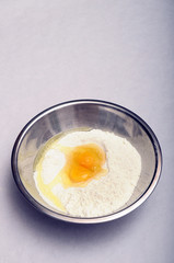 Bowl with flour and eggs