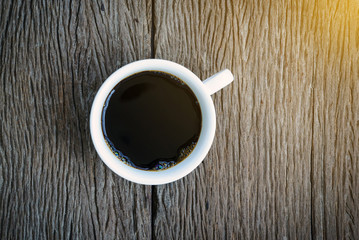 Coffee cup top view on  wooden background.