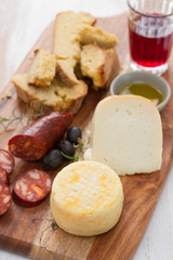 cheese with smoked sausage, bread and red wine