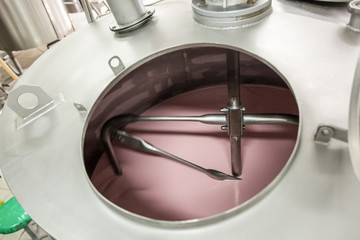 Vat-machine rotating blades of milk in ice-cream factory