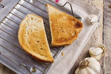 healthy and tasty mushrooms soup with sour cream on rustic wood background