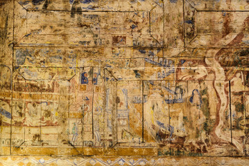 Fototapeta na wymiar Ancient Thai mural painting on wooden temple wall