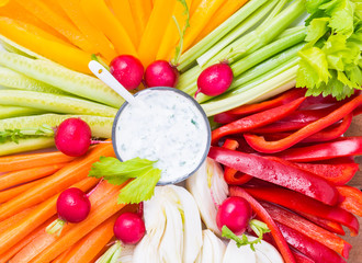 Vegetables plate rainbow colors background.