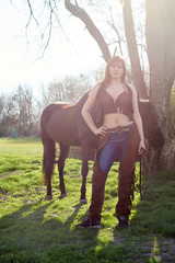 Cowboy woman on a pasture