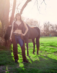 Cowboy woman on a pasture