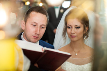 wedding ceremony of stylish elegant brunette bride and groom win