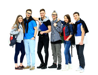 group of smiling friends staying together and looking at camera isolated on white background