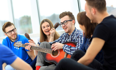Young people playing guitar